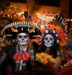 Couple in festival attire during el dia de los muertos