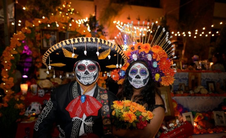 Couple in festival attire during el dia de los muertos