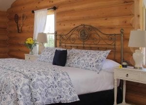 View of the French Open room bed and nightstands