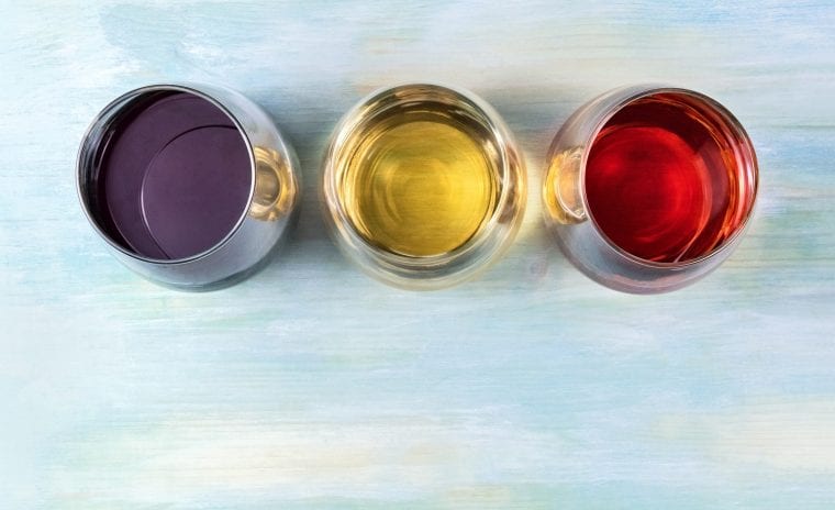 Three glasses of different kinds of wine