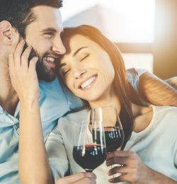 Couple with glasses of red wine