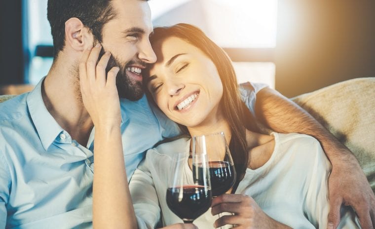 Couple with glasses of red wine