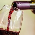 Pouring Red Wine in a Glass