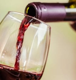 Pouring Red Wine in a Glass