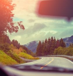 View from windscreen. Driving a car on mountain road. Nature Norway